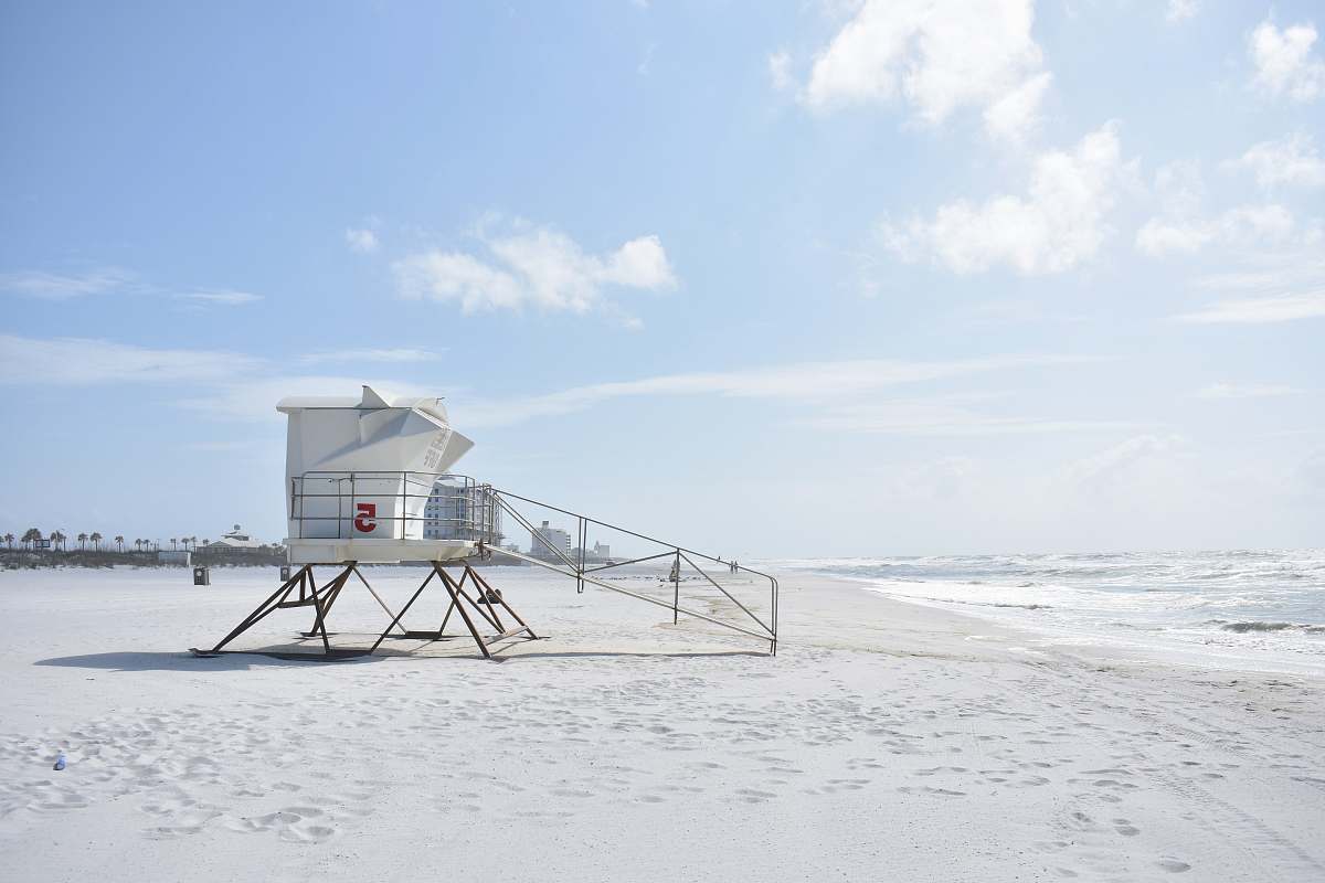 united states white life guard house on seashore ocean